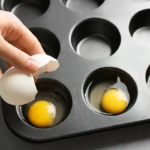 Eggs in a muffin tin demonstrating how to freeze eggs for cooking.